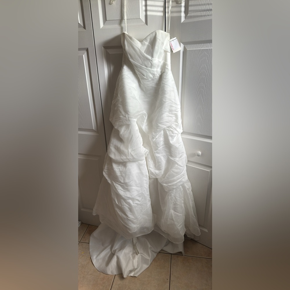 NEW wedding dress. Galina brand. Size 12. From David’s bridal. Strapless gown